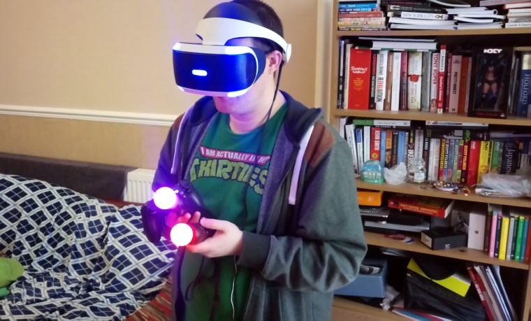 Look how cool as fuck I am here. Actually, this is me trying to grab a screenshot with the Share button on the Dualshock 4 while trying to play a game that uses both Move controllers. I look a prize weapon